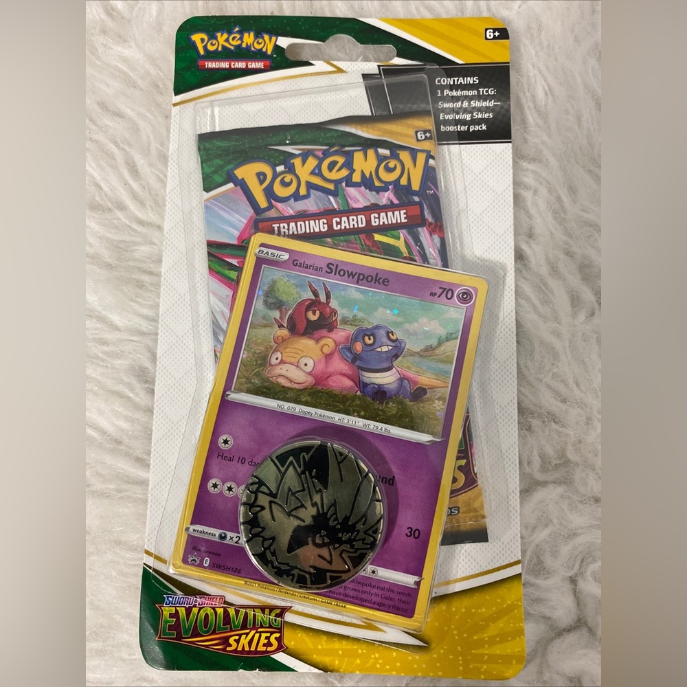Pokémon Slowpoke booster pack and coin - Picture 1 of 3